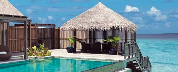 pool and beach scene with sun hut